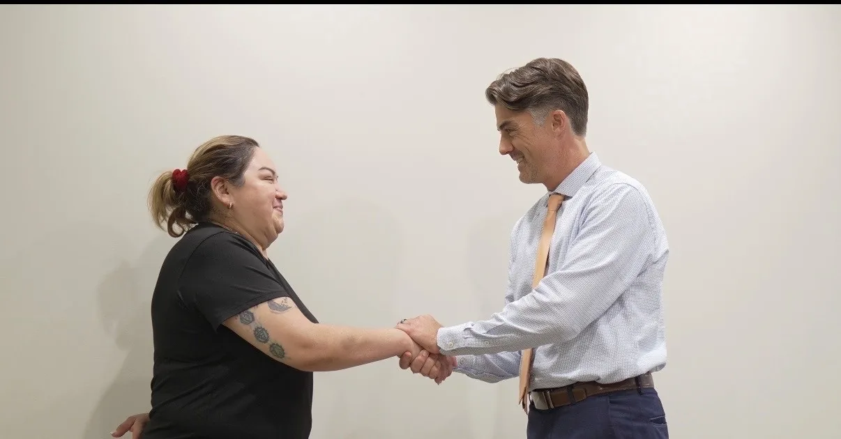 Jason Marker shaking hands with a client